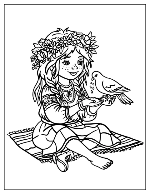 ピクニックシートに座る花冠の女の子が、ハトに餌をあげています。