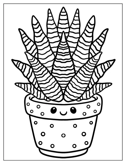 Una haworthia cebra crece en una maceta de lunares con una cara sonriente.