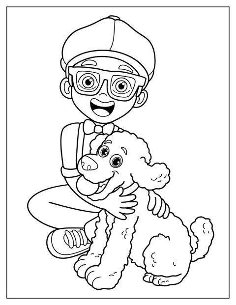 Mladý Blippi si hraje se psem na zemi.