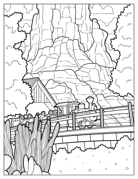 Un treno corre tra le rocce sulla Big Thunder Mountain Railroad di Disneyland.