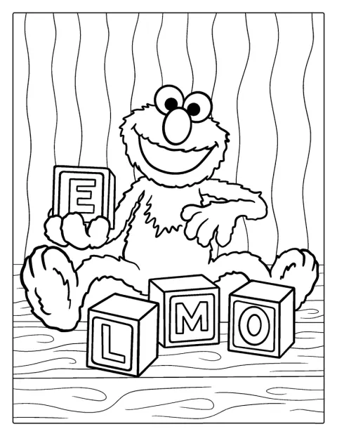 Elmo si hraje s kostkami s písmeny abecedy.
