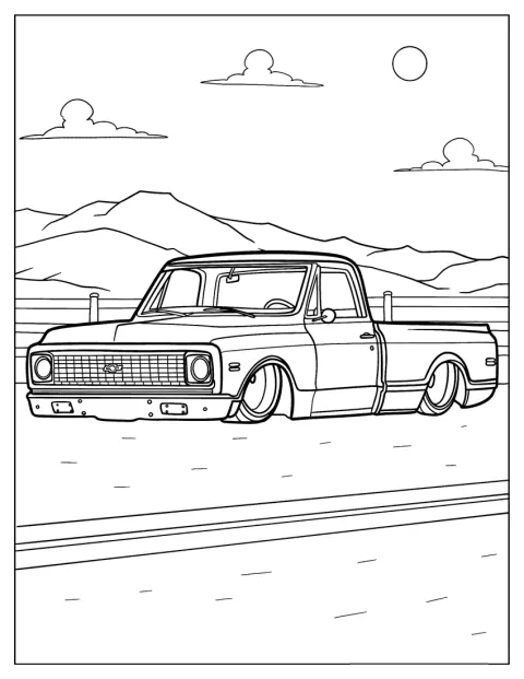 Un pick-up Chevrolet C10 se trouve devant une chaîne de montagnes.
