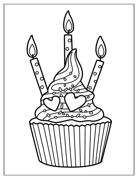 En cupcake er klar til fødselsdag med festlig pynt.
