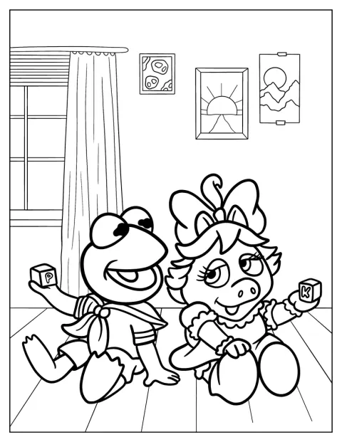 Baby-Kermit sitzt neben Baby-Miss-Piggy.
