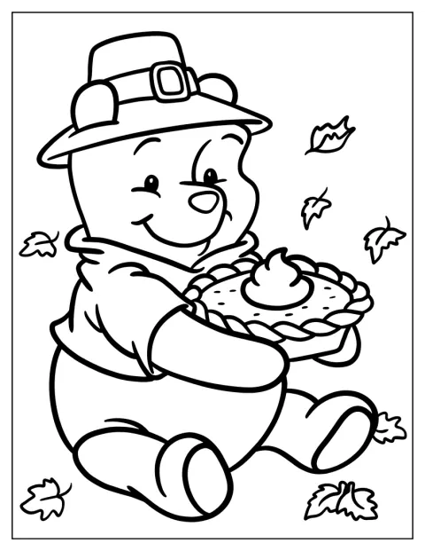 Winnie the Pooh tiene in mano una torta del Ringraziamento.