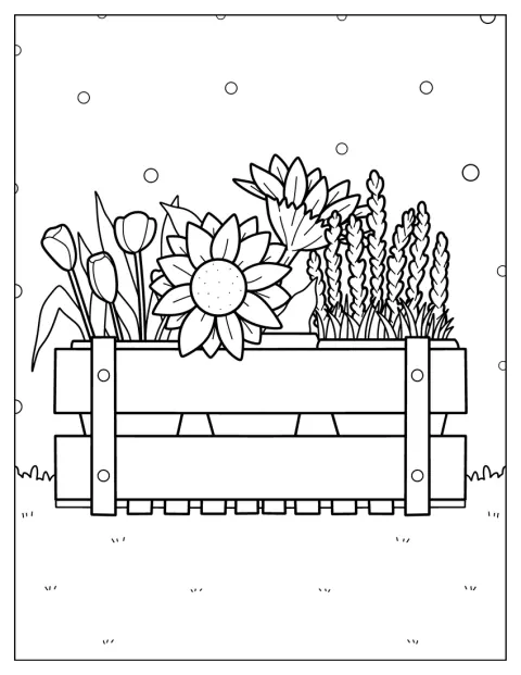 Varias flores crecen en una jardinera rectangular.