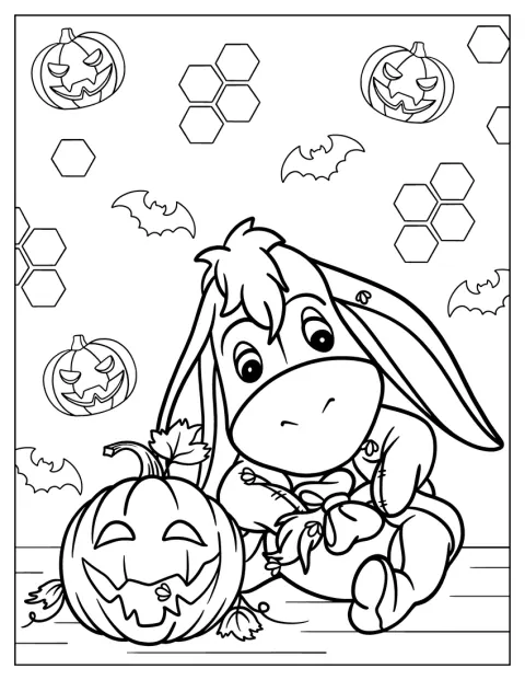 ハロウィンのかぼちゃ提灯のそばに、イーヨーがいます。